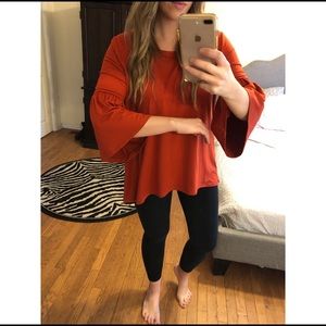 Burnt orange bell sleeve top